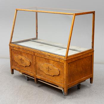 A 1930's birch display case.