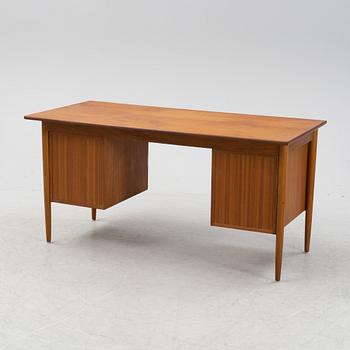 A teak veneered desk, 1950's/1960's.