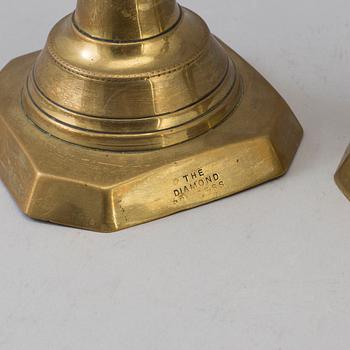 A PAIR OF ENGLISH 19TH CENTURY BRONZE CANDLSTICKS.