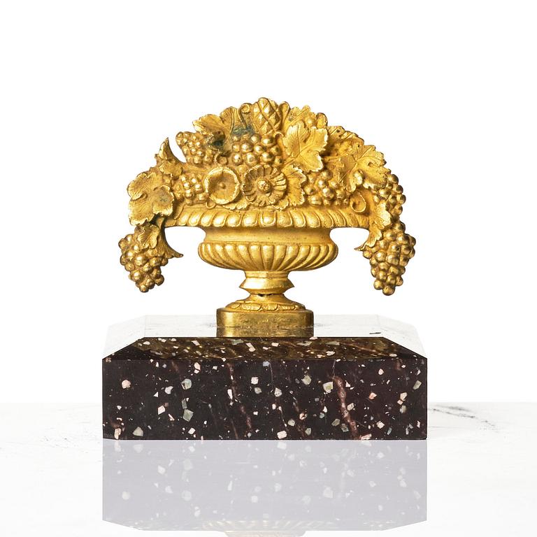 An Empire 'Loka-Risberg'-porhyry and ormolu paperweight, Älvdalen, early 19th century.