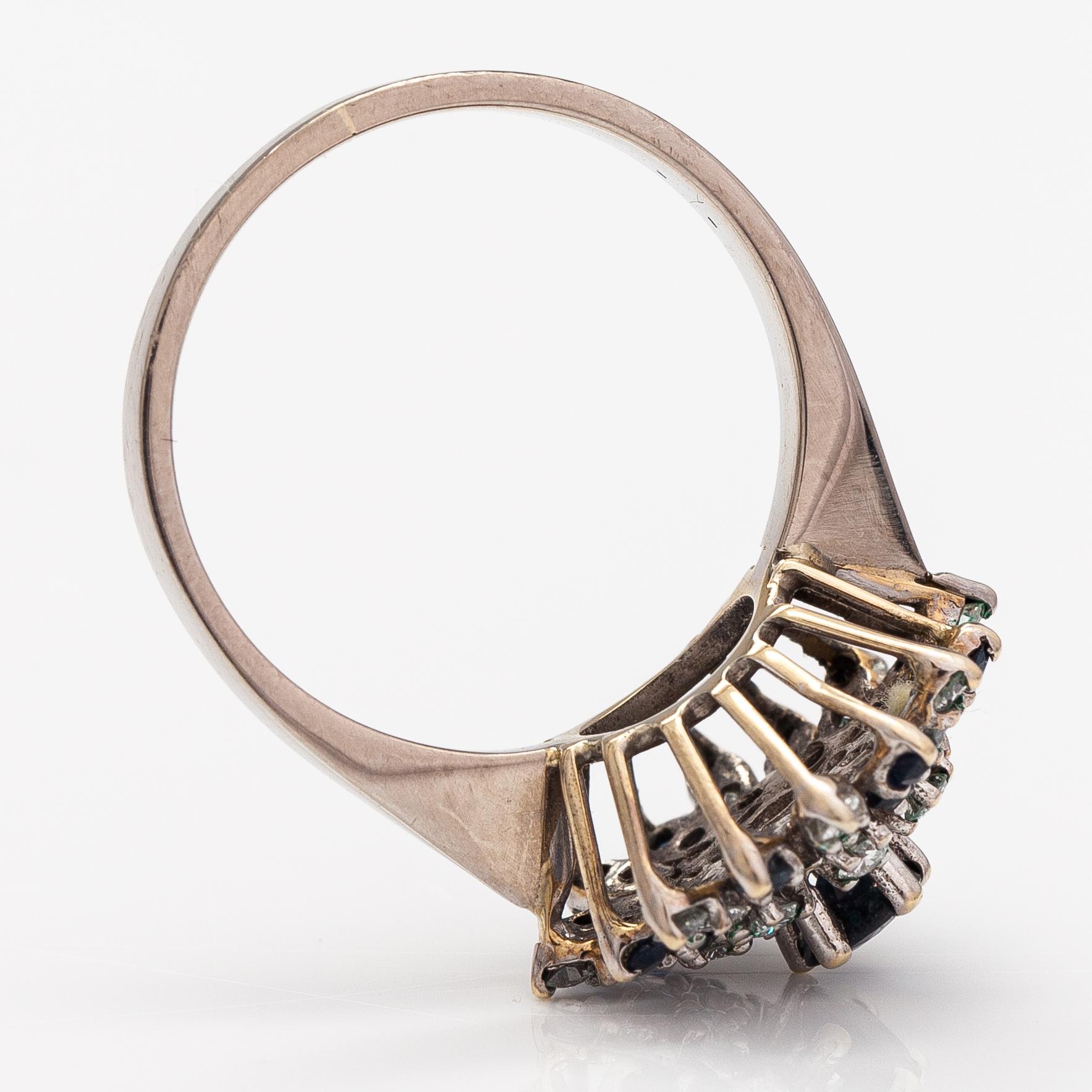 Ring, 18K vitguld, diamanter ca 0.56 ct tot och safirer. J S Guldsmide, Göteborg 1991.
