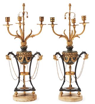 A pair of  Louis XVI-style late 19th century three-light candelabra.