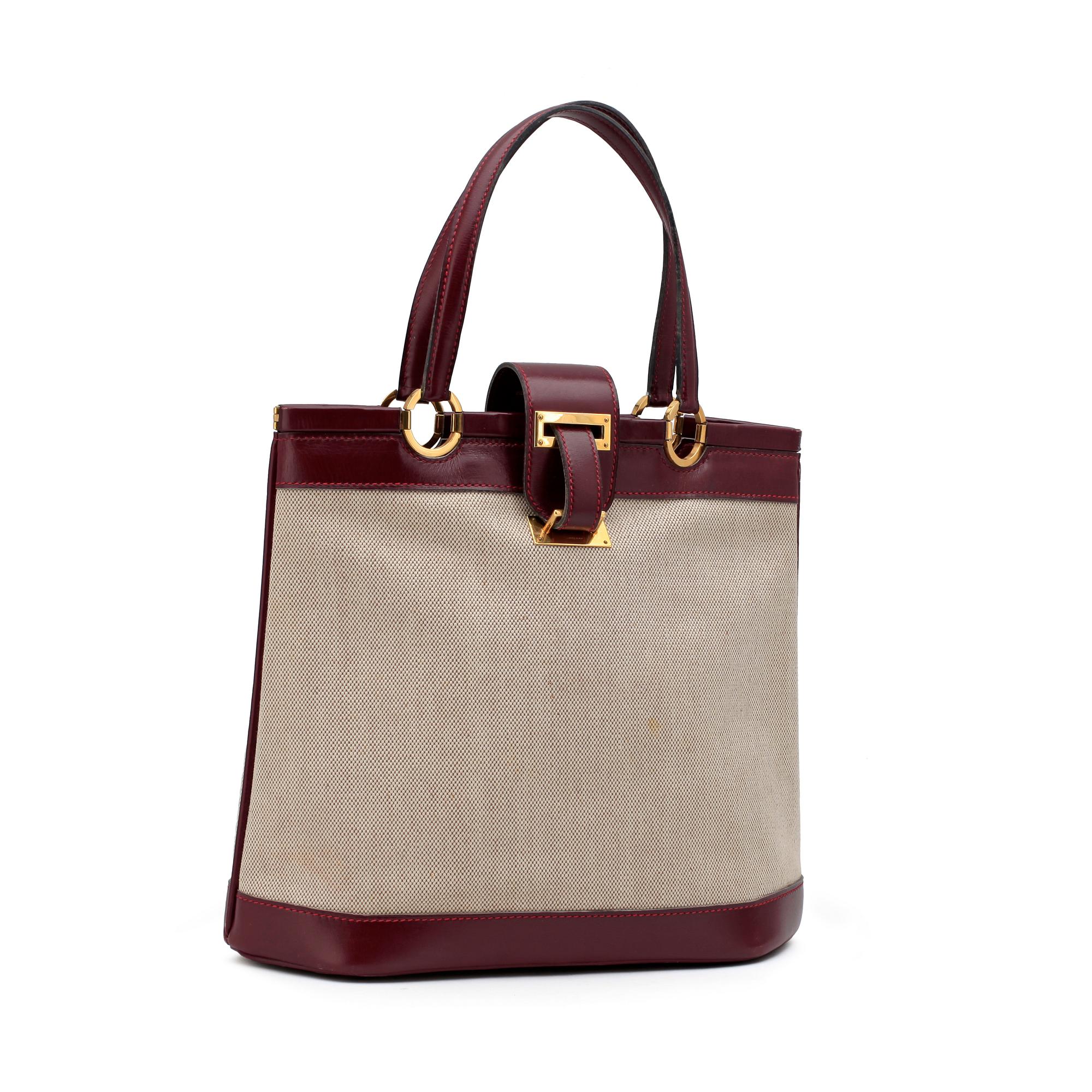 HERMÈS, a canvas and leather handbag.