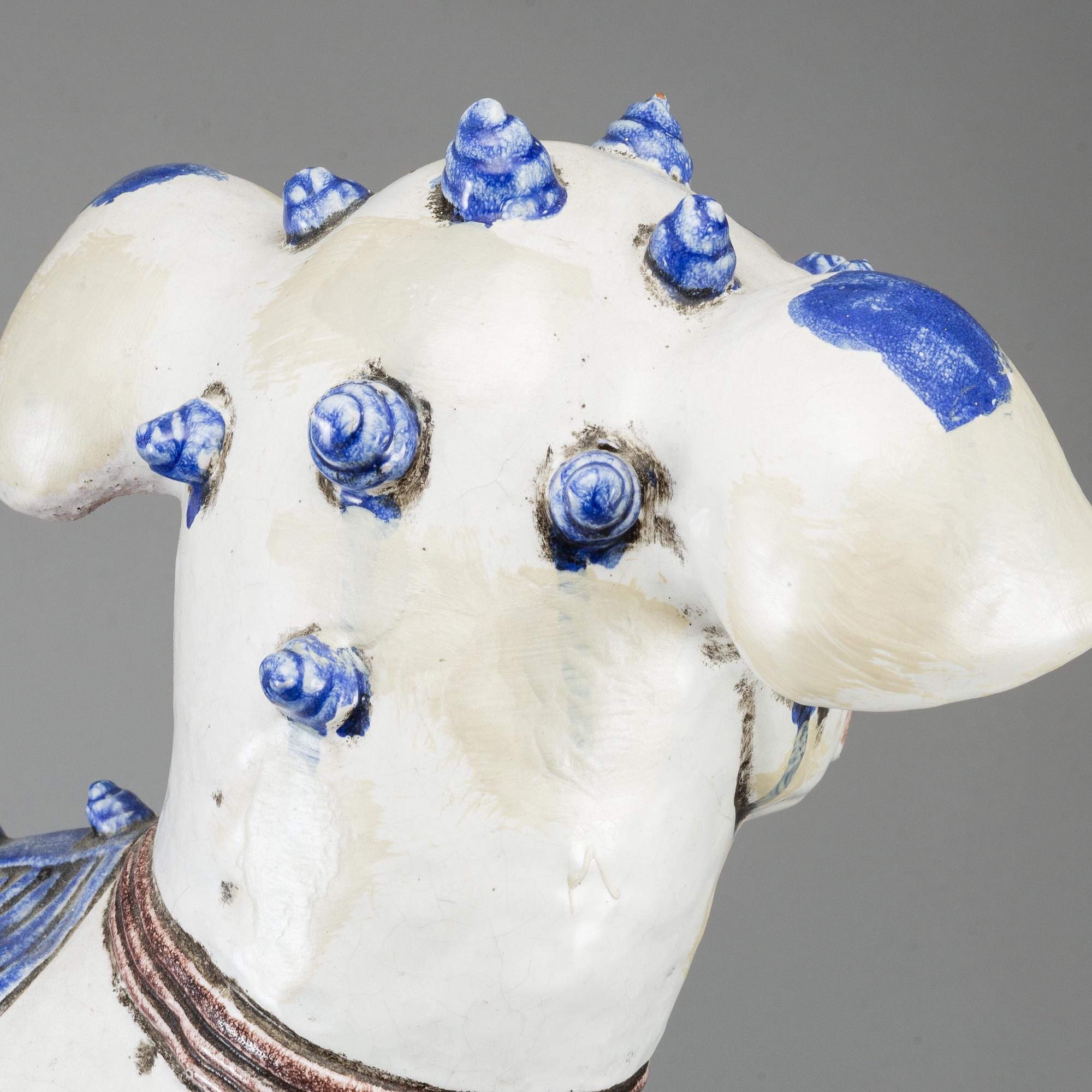 A large Chinese ceramic tile sculpture of a buddhist lion, 20th century.