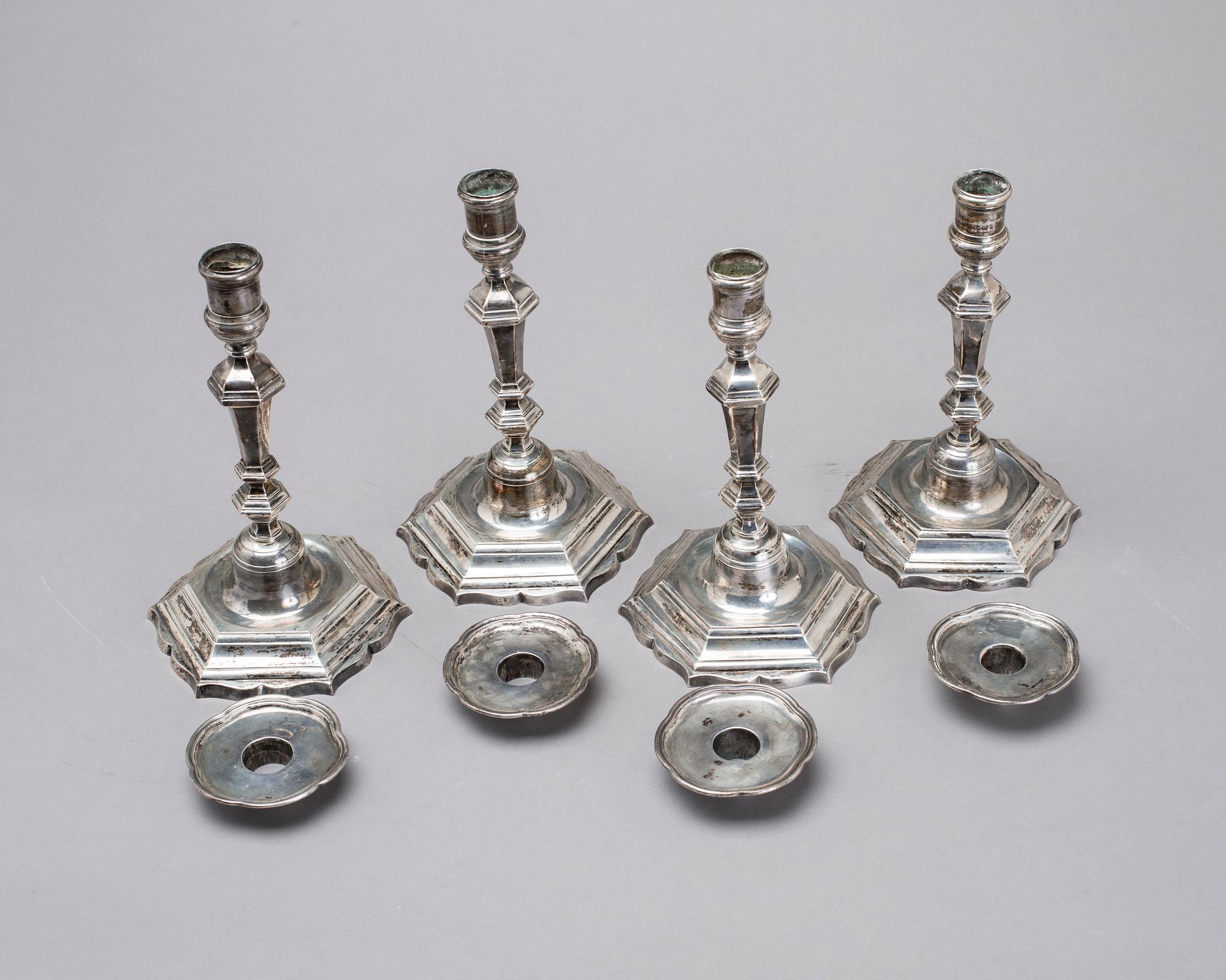 Two simular pairs of candlesticks, two marked Barde, Geneve 18th century, two with later marks.