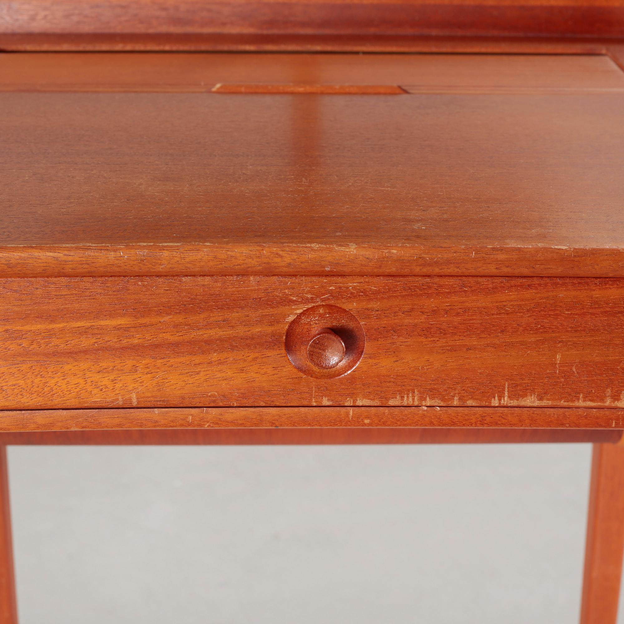 a table with mirror "Birgitta" veneered with teak designed by Carl Malmsten for Bodafors Möbelfabrik,