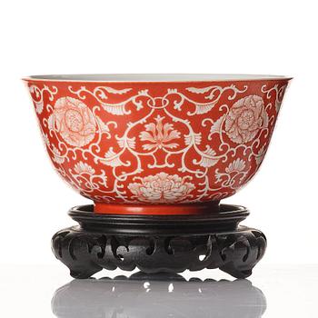 A coral red reverse decorated lotus bowl, Qing dynasty with Daoguang mark in underglaze blue.