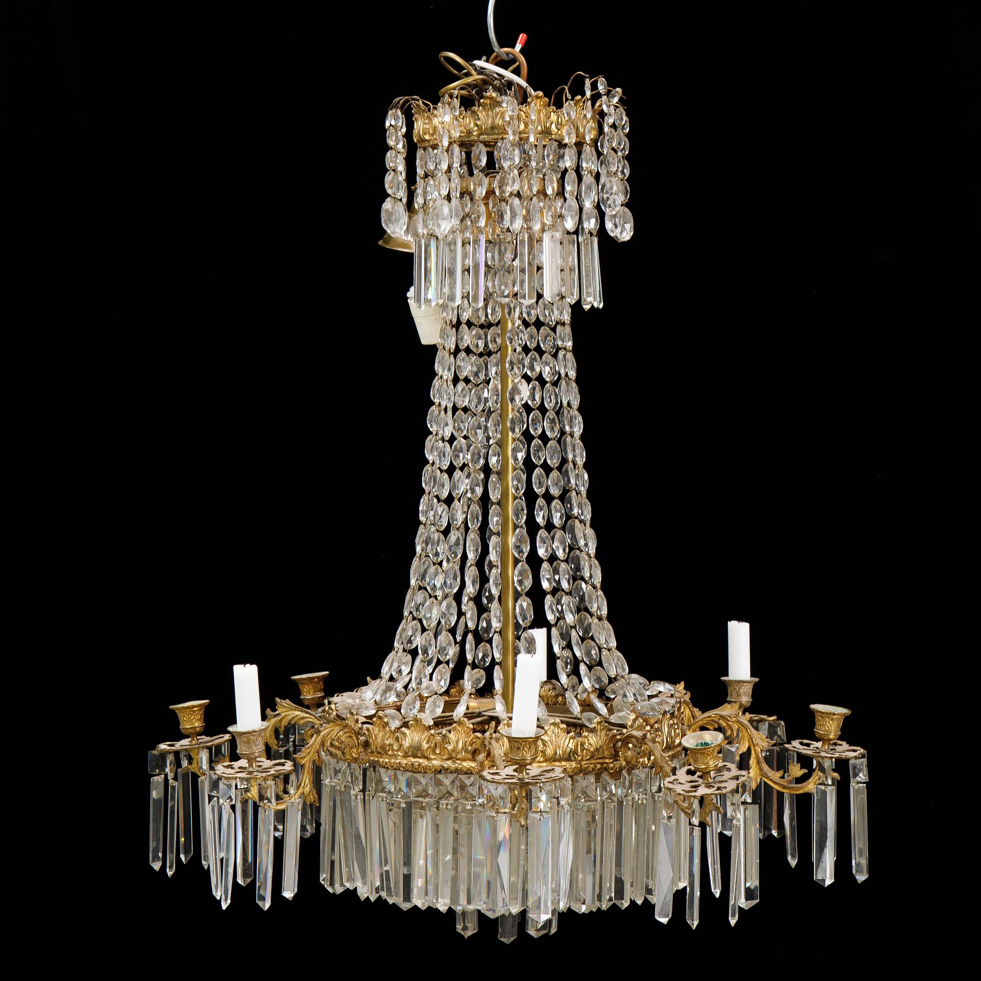 An Oscarian gilt brass eight-light chandelier.