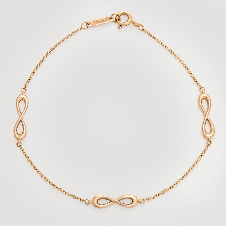 Tiffany & Co, an 18K gold 'Infinity Endless' bracelet.
