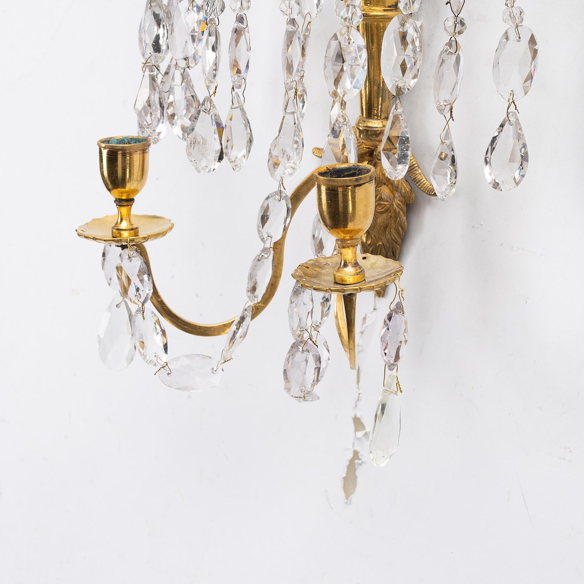 A pair of late Gustavian ormolu two-branch lustres, circa 1800.