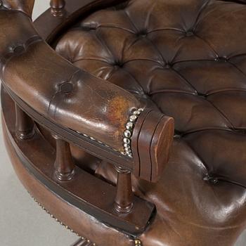 A desk chair in English style, made in the second half of the 20th century.