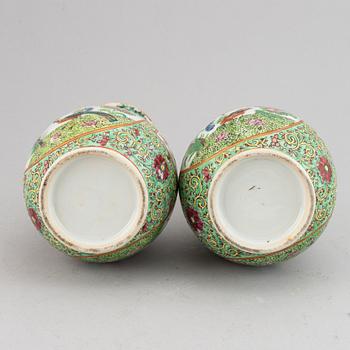 A pair of famille rose canton vases, early 20th century.