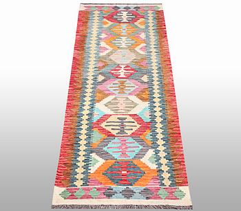 A Kilim runner, a. 294 x 82 cm.