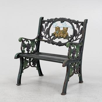 A children's cast iron garden sofa and armchair, mid 20th century.