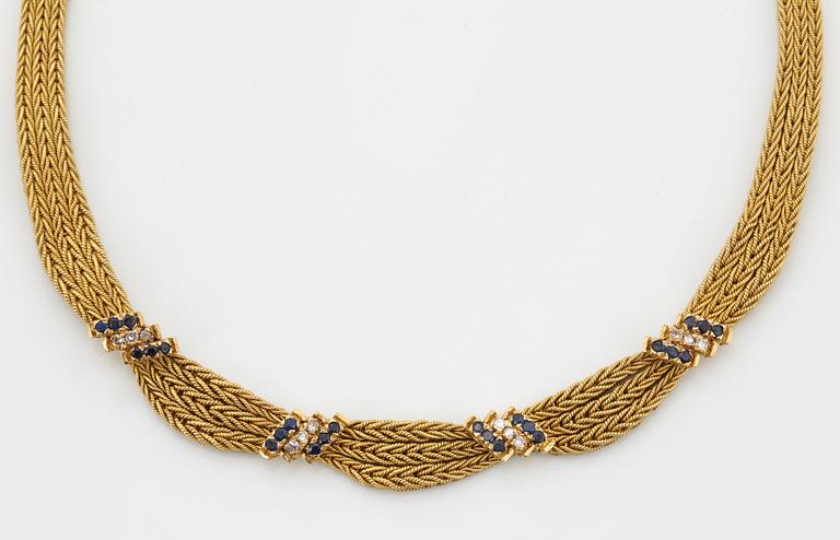 An 18K gold necklace set with eight-cut diamonds and sapphires.