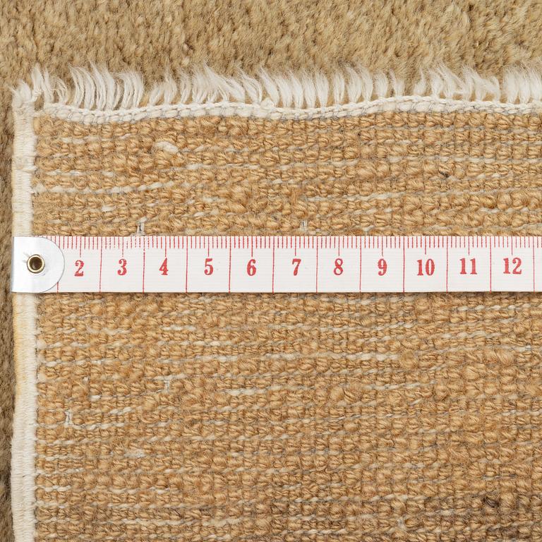 An antique Baotou rug, China, c. 127 x 66 cm.