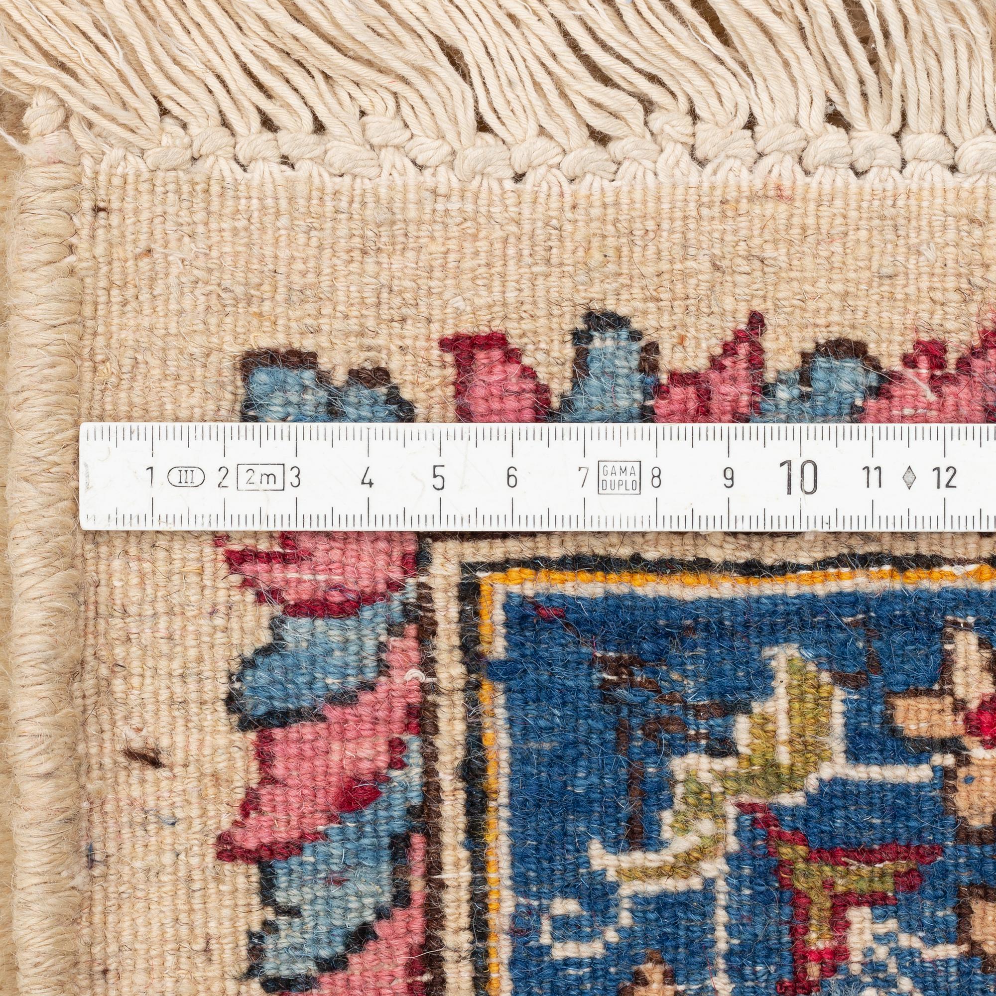 A carpet, old Kerman, approx. 314 x 210 cm.