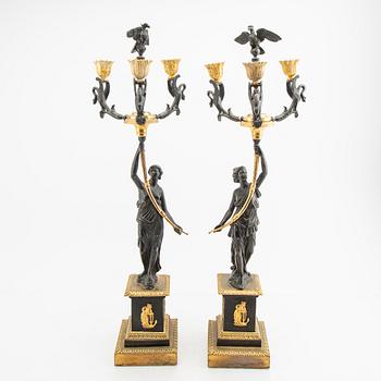 A pair (nearly) of Empire style candelabras later part of the 19th century.