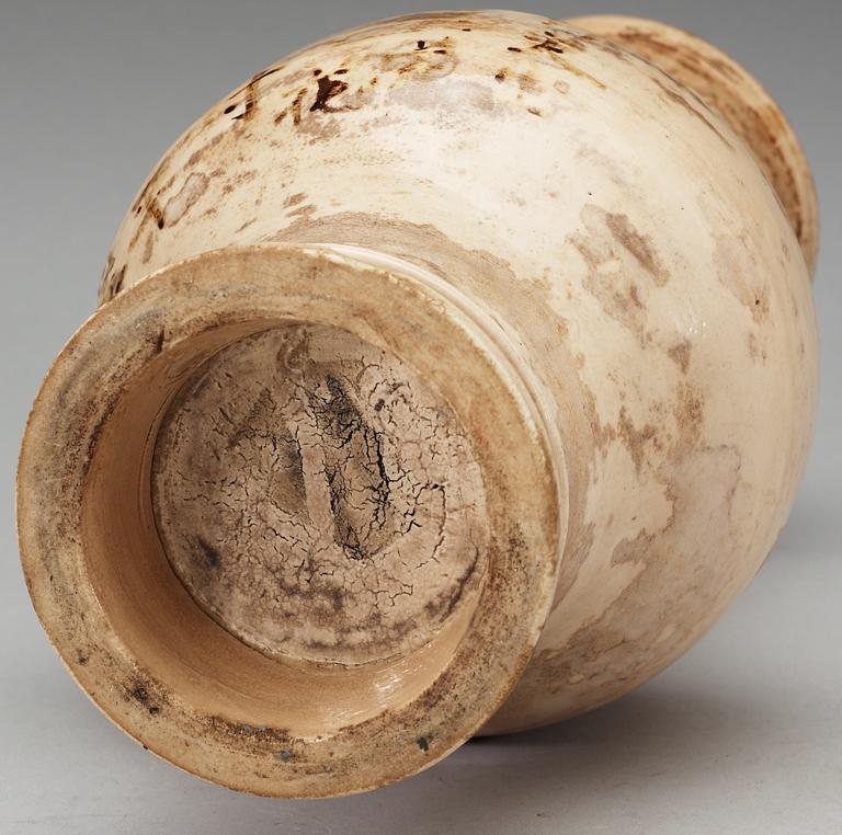 A cream glazed vase, Ming dynasty, with an inscription that dates it to 1608.