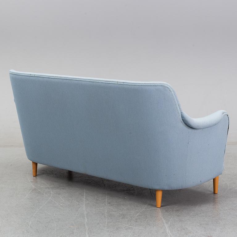 A 'Samsas' sofa and easy chair by Carl Malmsten dared 1985.