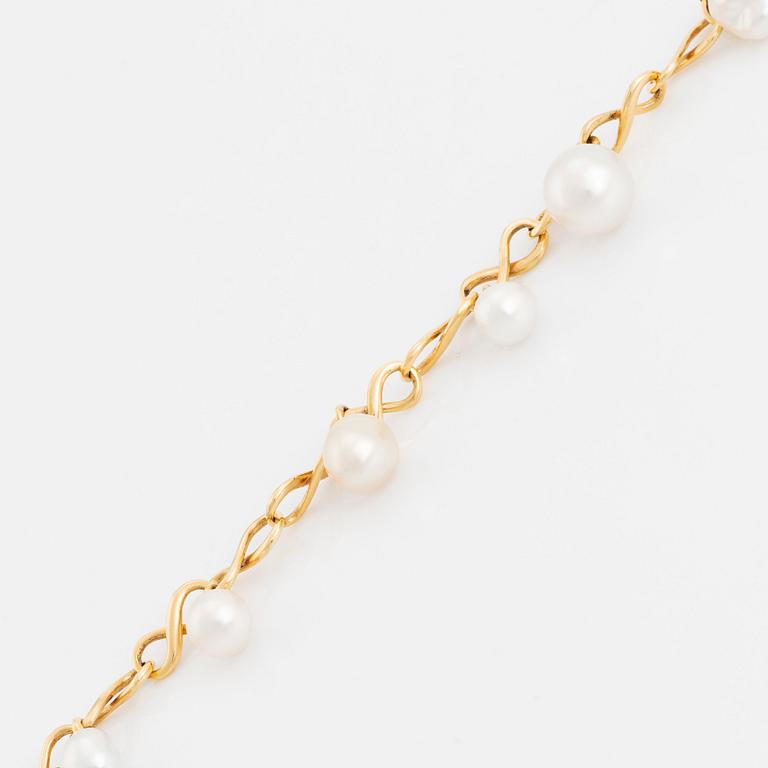 An 18K gold and cultured Keshi pearl bracelet.