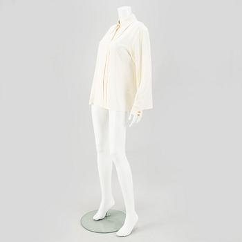 A Crepe de Chine Cream Coloured Silk Blouse by Chanel.