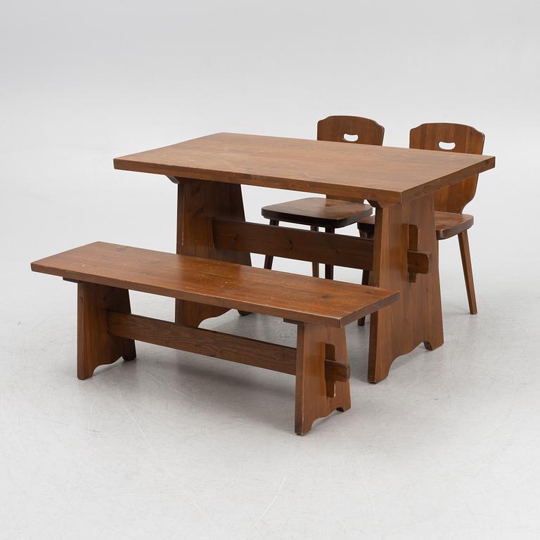 A pine dining table with a bench and two Göran Malmvall chairs, mid 20th century.