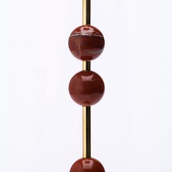 Sigurd Persson, A pair of brass and red jasper candlesticks, Uno Berg AB, Sweden.