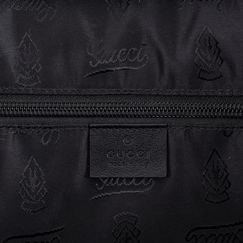 Gucci, a briefcase.