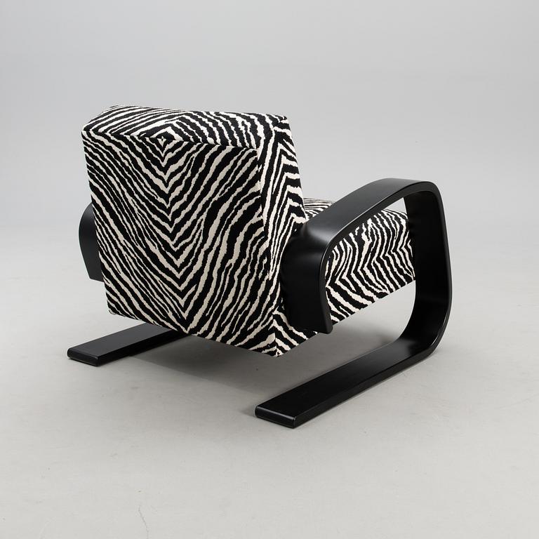 An armchair no 400, designed in 1936.