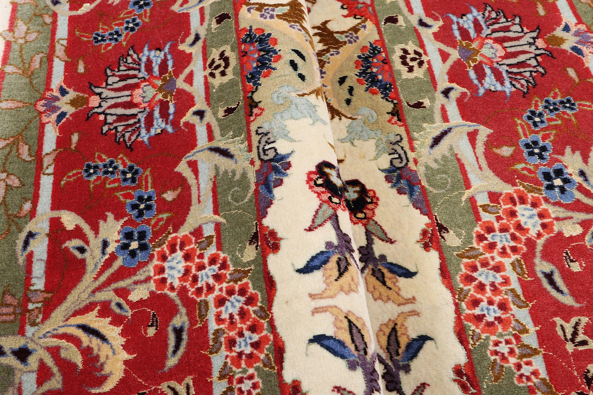 A Tabriz carpet, part silk, 50 raj, c. 204 x 154 cm.