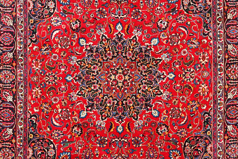 A Najafabad carpet, c. 351 X 305 cm.