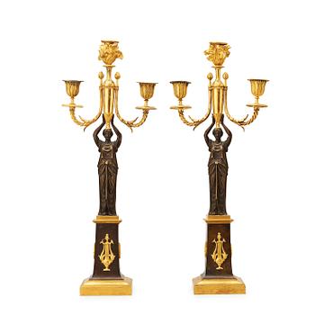 499. A pair of  Empire early 19th century three-light candelabra.