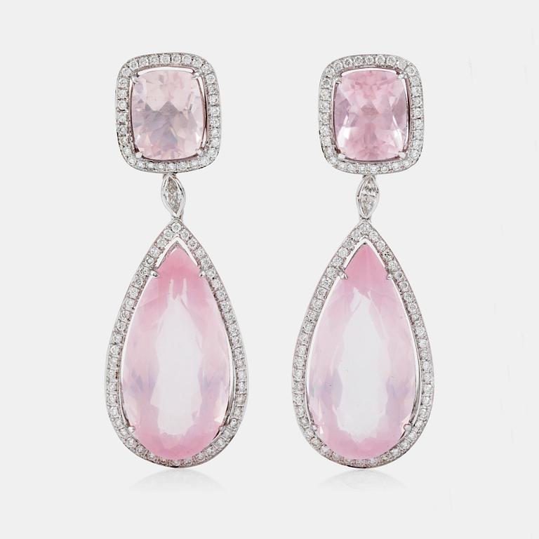 A pair of rose quartz, circa 34.00 ct, and diamond, circa 1.32 ct, earrings.