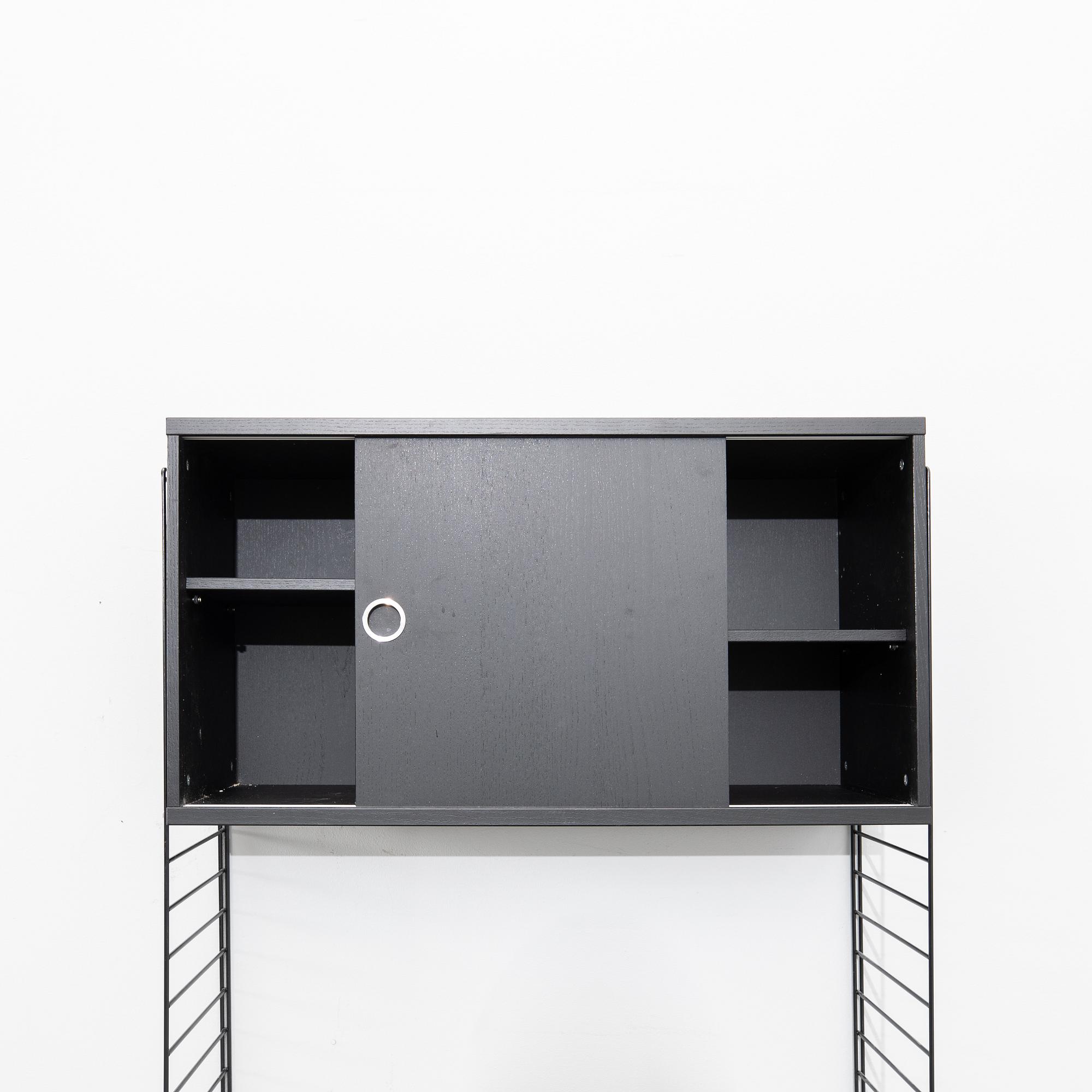 Nils Strinning, Hyllsystem.