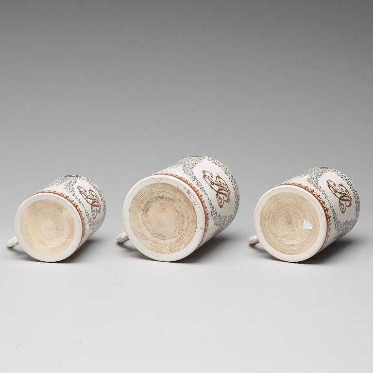 A group of three famille rose armorial jugs, Qing dynasty, Qianlong (1736-95).