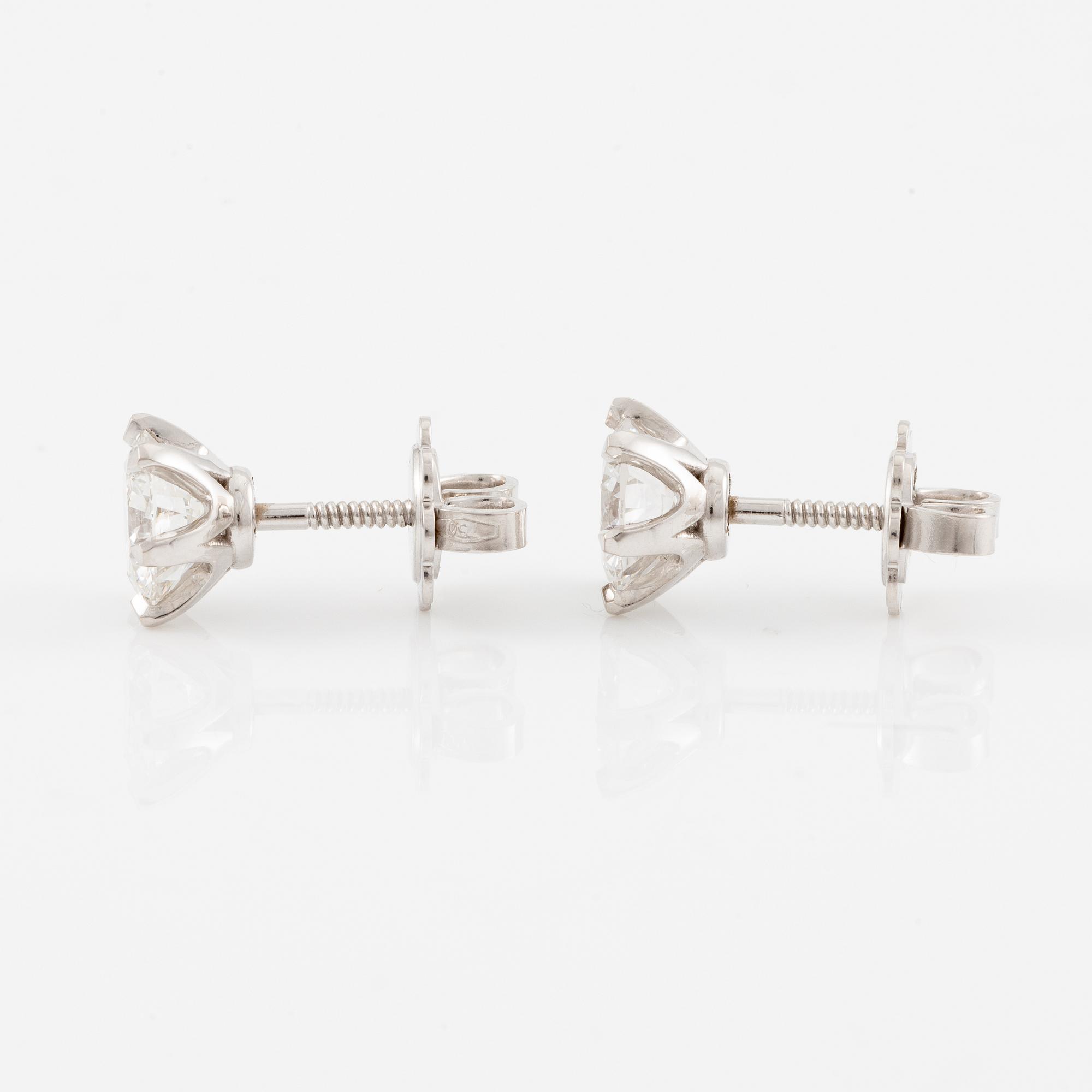 Brilliant-cut diamond stud earrings.