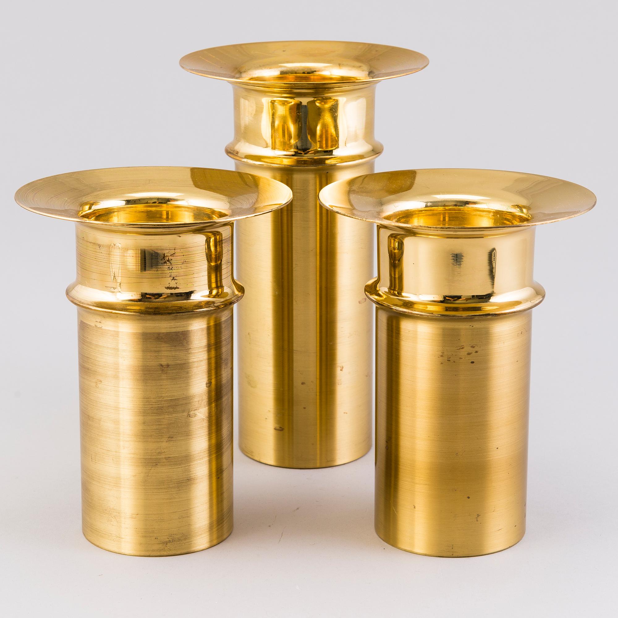 TAPIO WIRKKALA, A set of three brass candleholders, all marked Kultakeskus Oy Made in Finland, Design Tapio Wirkkala.