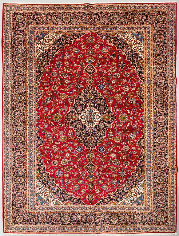 A Keshan rug, signed, 410 x 295 cm.
