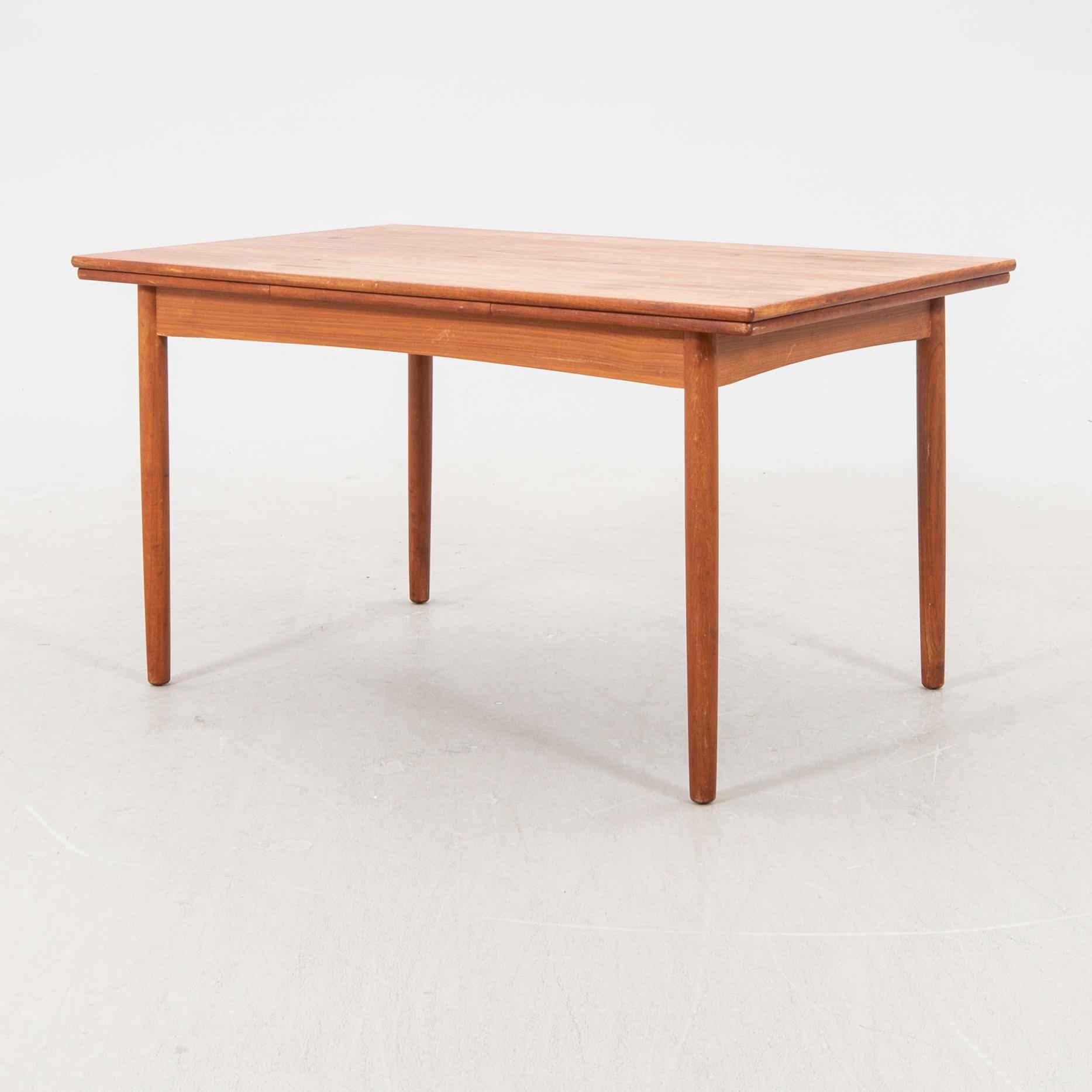 A 1960s teak dining table.