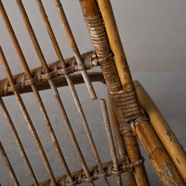 a pair of rattan easy chairs, 20th century.