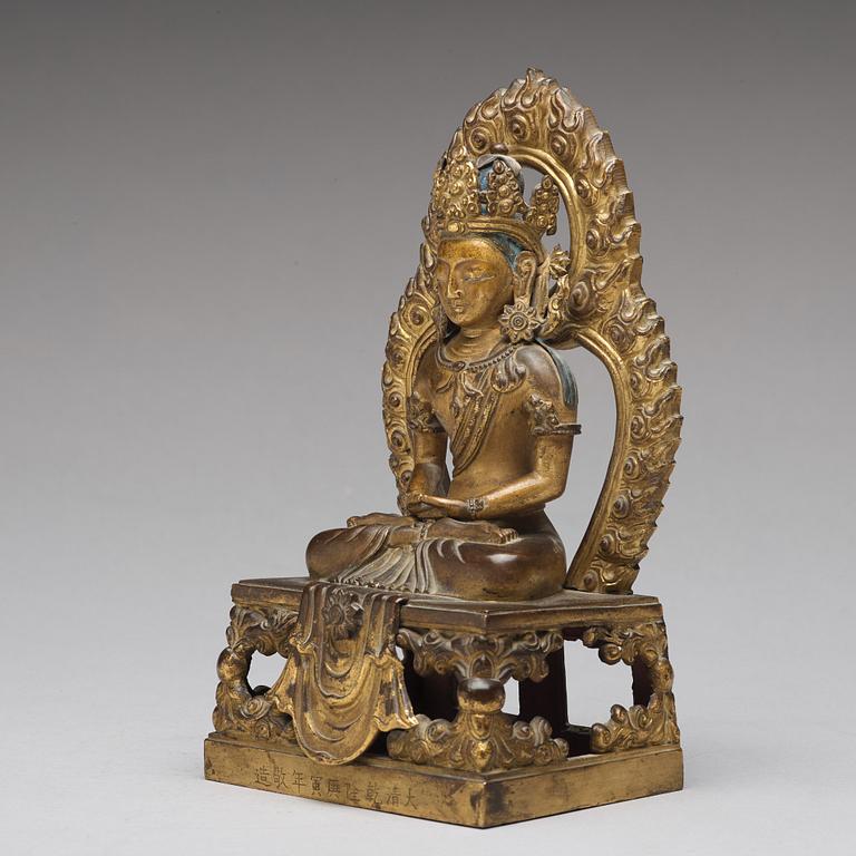 A gilt bronze seated figure of Amitayus, Qing dynasty, Qianlong period, dated by inscription.