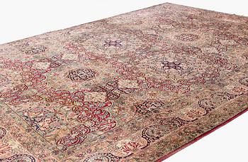 An antique Kerman Laver carpet, south east persia, ca 501 x 359 cm.