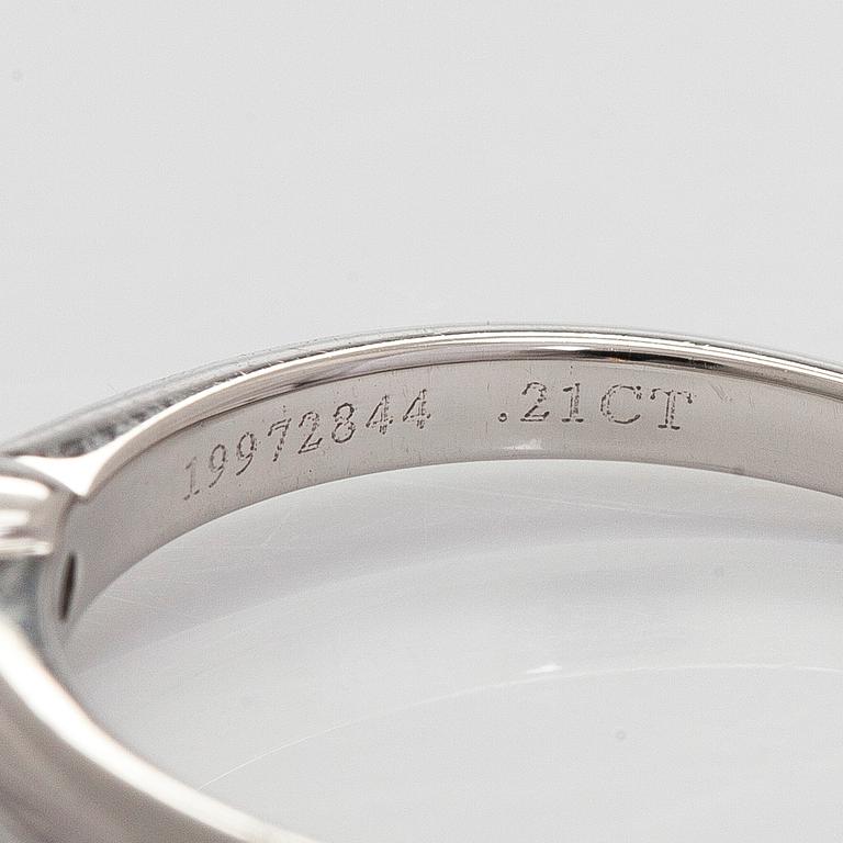 Tiffany & Co, a platinum solitaire ring with a brilliant-cut diamond.