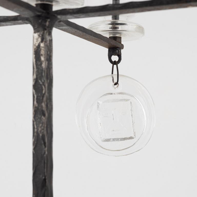Erik Höglund, a iron and glass candelabra.