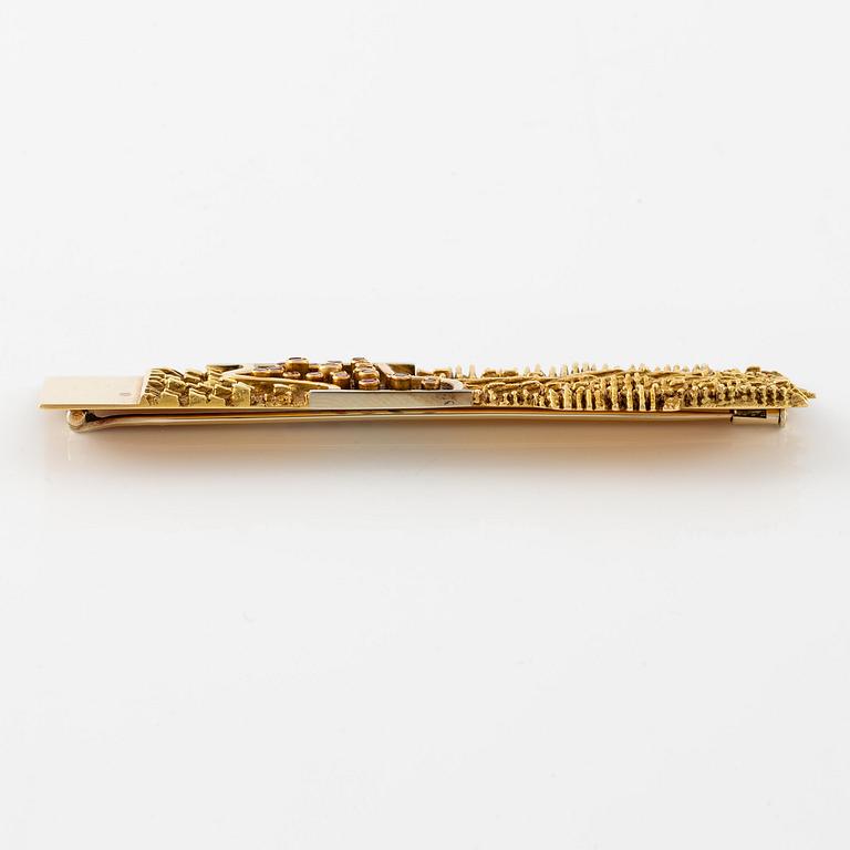 Arnaldo Pomodoro, a brooch, 18K gold with rubies, Italy 1962.