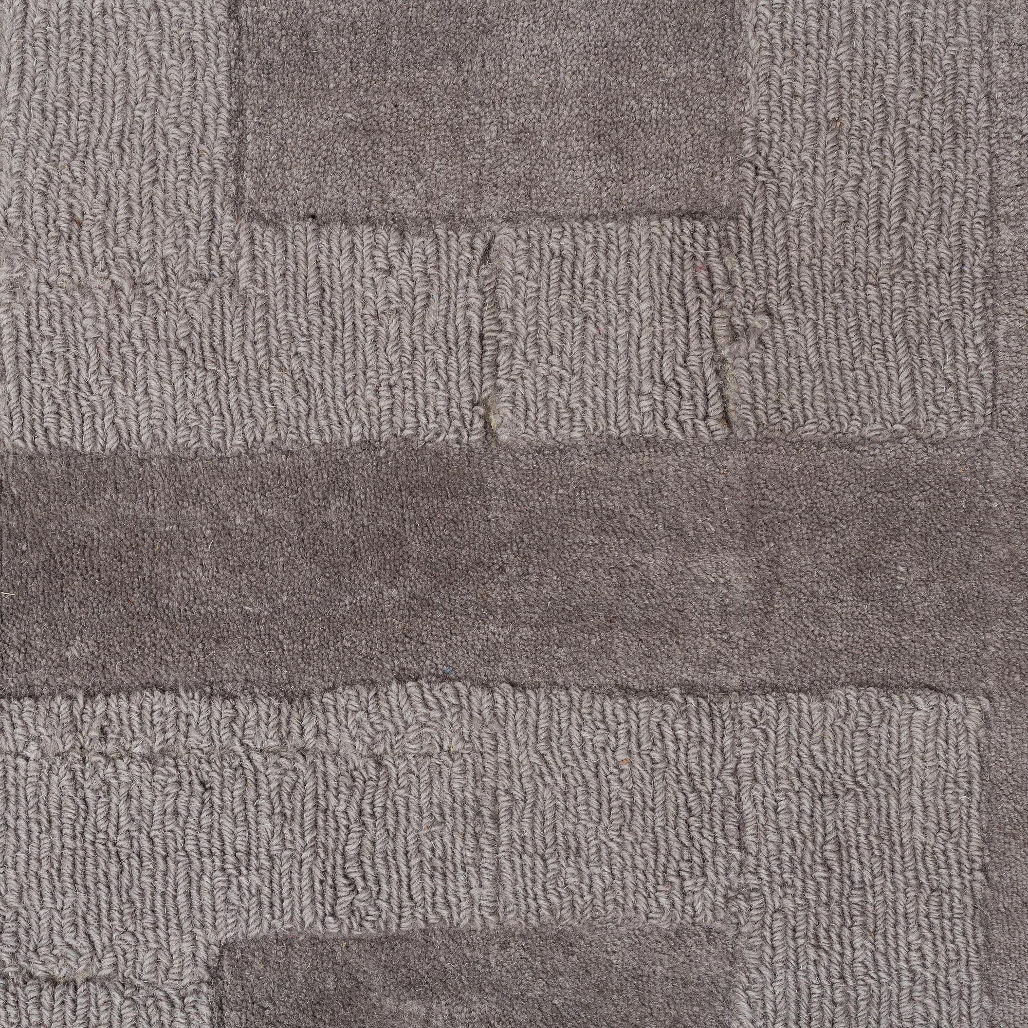 A Layered "Wool Cubes" carpet, 390x620 cm.