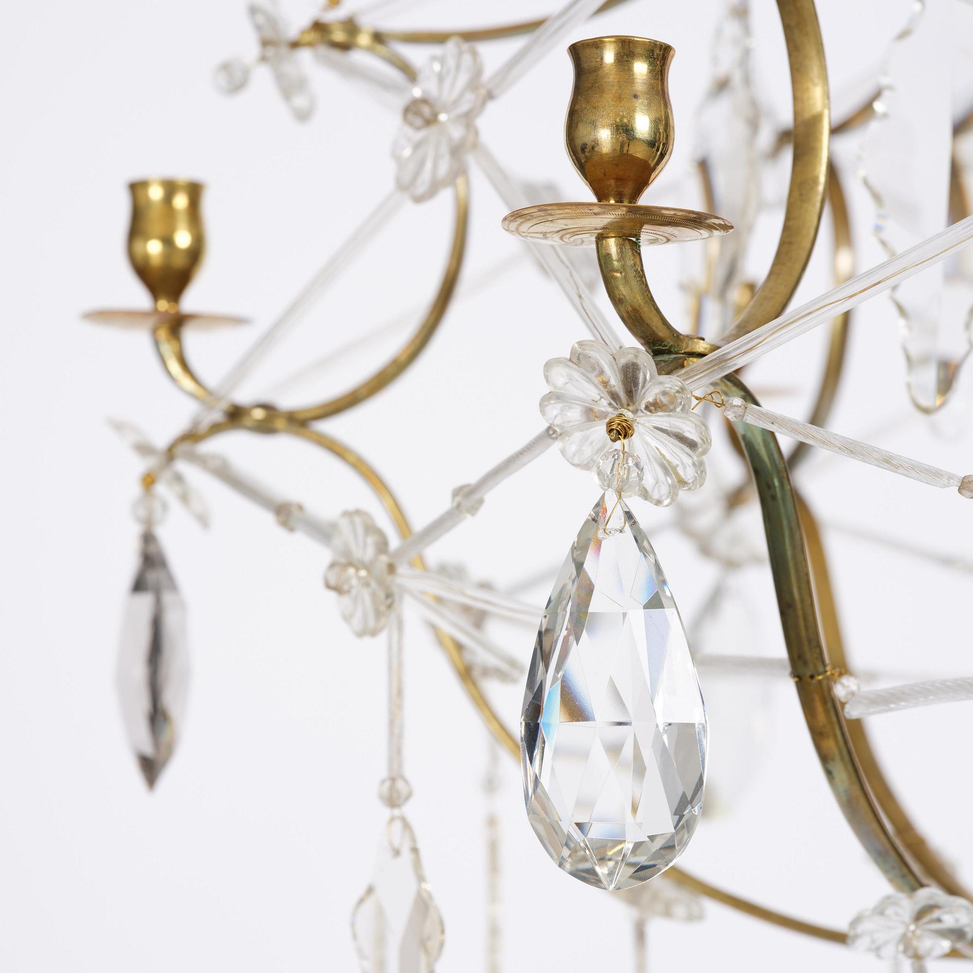 A seven-light gilt brass and cut glass rococo chandelier, mid 18th century.