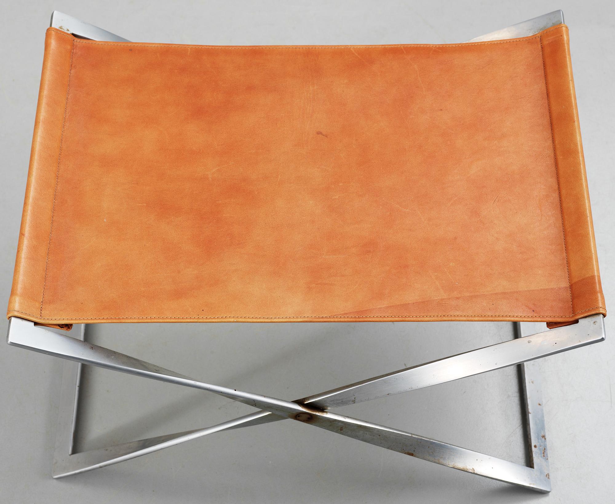 A Poul Kjaerholm 'PK-91' steel and brown leather stool, Fritz Hansen, Denmark.