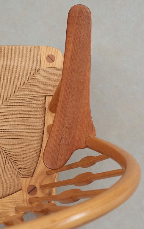 A Hans J Wegner ash and teak 'Peacock chair', Johannes Hansen, Denmark.